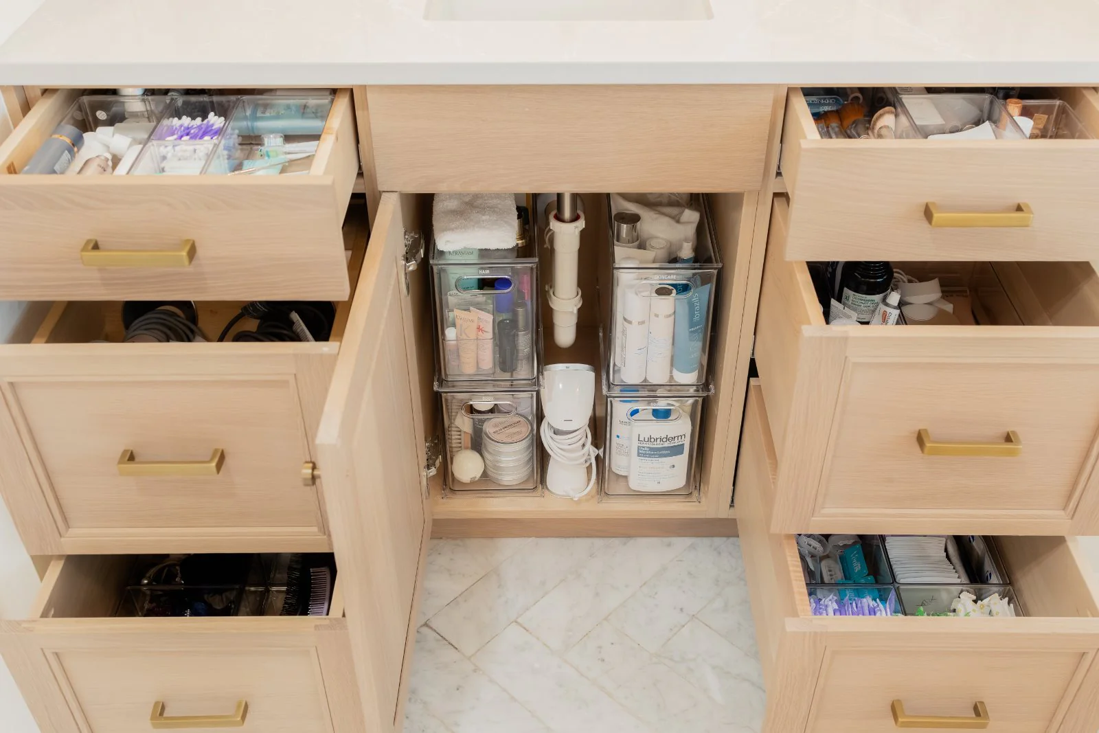 An organized bathroom vanity, every drawer divided